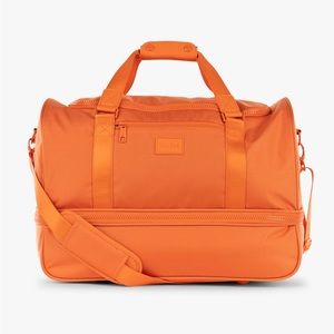 Calpak Stevyn Duffle Bag in Orange